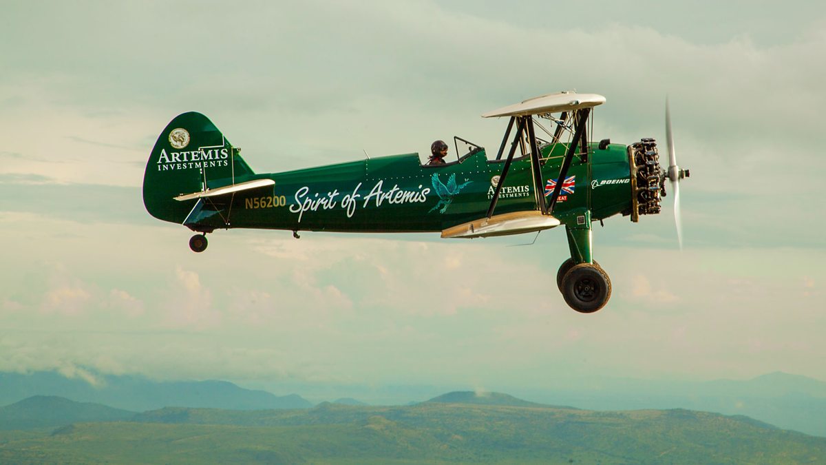 The Spirit of Artemis Biplane flies over Africa