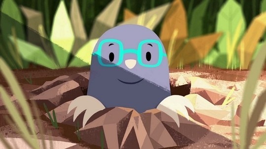 An animated mole peeks his happy face above ground