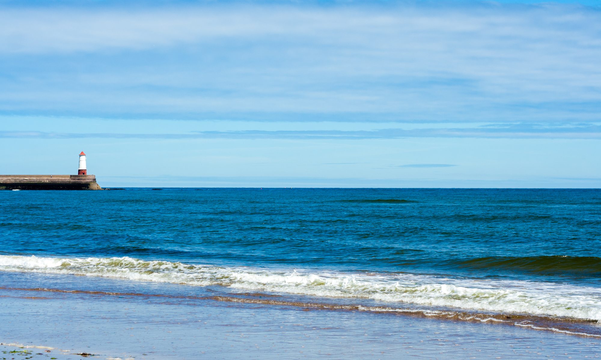 Lighthouse, beach and sea at Tweedmouth