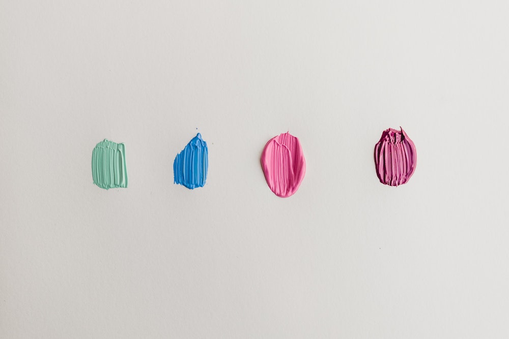 Limit Your Palette for Maximum Creativity Ashley west edwards four green, blue, and pink paints for Unsplash
