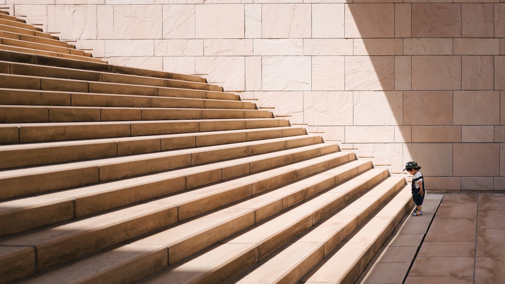 Just Start - Jukan Tateisi Toddler's Standing in Front of Beige Concrete Stair - for Unsplash
